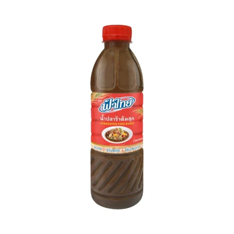 Fathai fermented fish sauce 400ml bottle, traditional dry grocery condiment with dark liquid in a clear glass bottle.