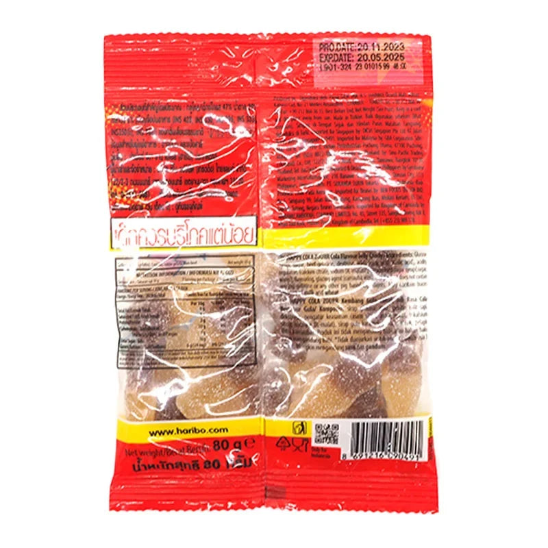 Haribo Gummy Happy Cola Zour candies in a clear bag, showing colorful cola-flavored gummy snacks from the confectionery brand.