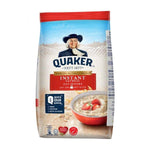 Bowl of Quaker Quick Instant Oats in a bowl with a spoon, showcasing the ready-to-eat oatmeal product from Quaker.