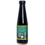 Bottle of Happy Choice Oyster Sauce No Msg, a grocery staple, with clear label and golden sauce inside a glass jar.