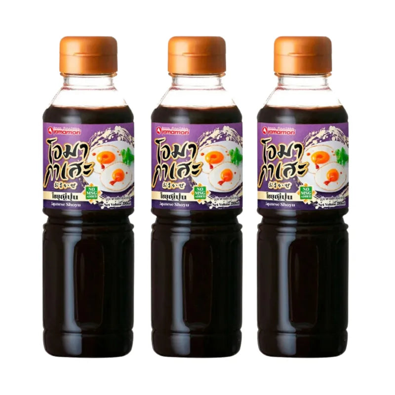 Three bottles of Omakase Japanese soy sauce, 200ml each, in a dry grocery setting, showcasing the sleek black label and packaging.