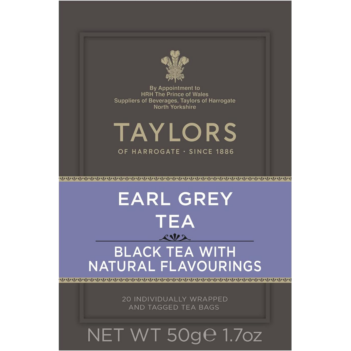 A cup of brewed Taylors Earl Grey Tea with a teapot and lemon wedge on a wooden table, showcasing the tea's rich color.