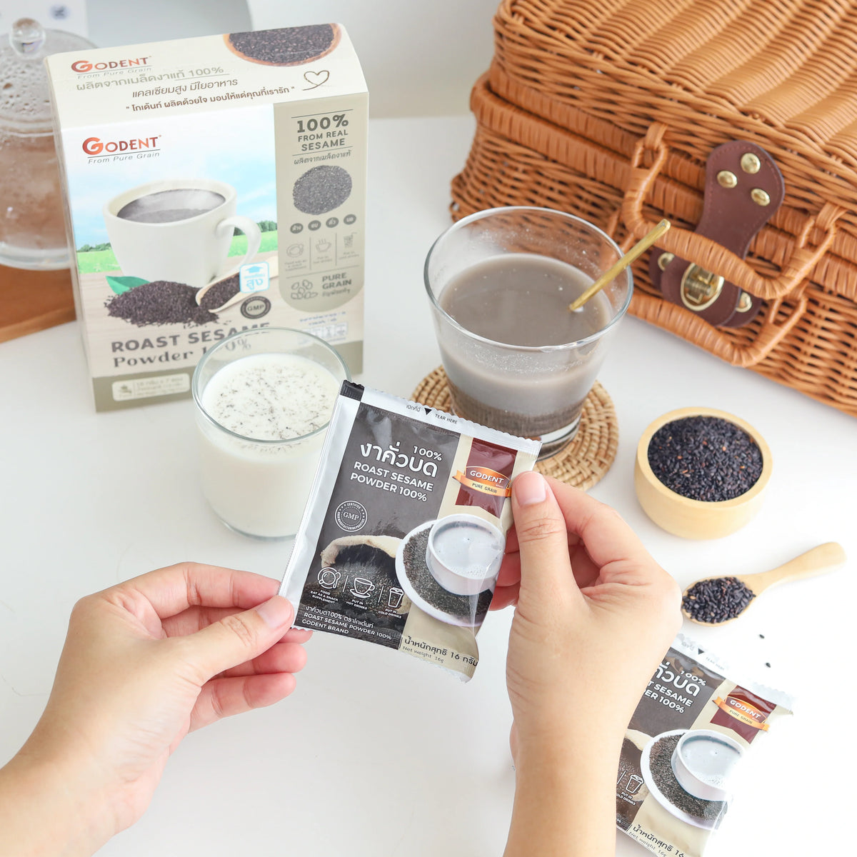 Godent Golden 100% ground roasted black sesame in 112g box, dry grocery product with golden packaging and black sesame seeds.