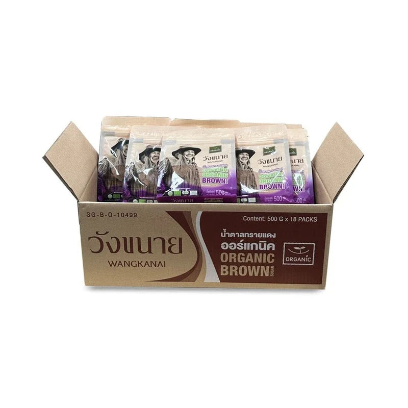 Wangkanai Organic Brown Sugar 500g in a clear plastic bag, showing coarse, dark brown sugar crystals.