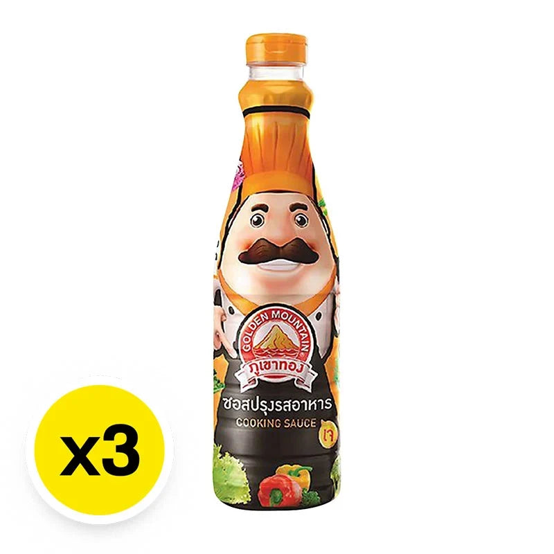 Golden Mountain Cooking Sauce 700ml bottle, part of a three-pack, in a clear bottle with golden label, ideal for Asian cuisine cooking.