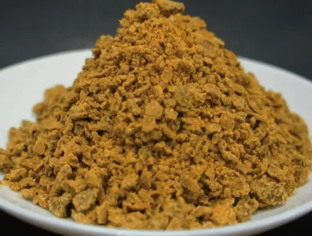S & B Oriental Curry Powder Mix with turmeric in a dry grocery package, showcasing the vibrant yellow spice blend for cooking.