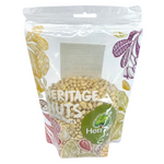 Heritage Raw Pine Nuts in a clear container, showcasing the natural, light-colored pine nuts used for confectionery snacks.