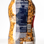 Planters Dry Roasted Peanuts in a bowl, showing golden, crunchy peanuts as a confectionery snack.