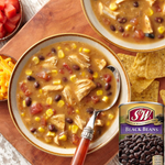 Canned S&W Black Beans in brine, showing the label and can with black beans visible through the opening.