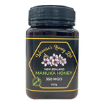 Jar of Wannisa New Zealand Manuka Honey 350 MGO with golden honey visible inside on a white background.