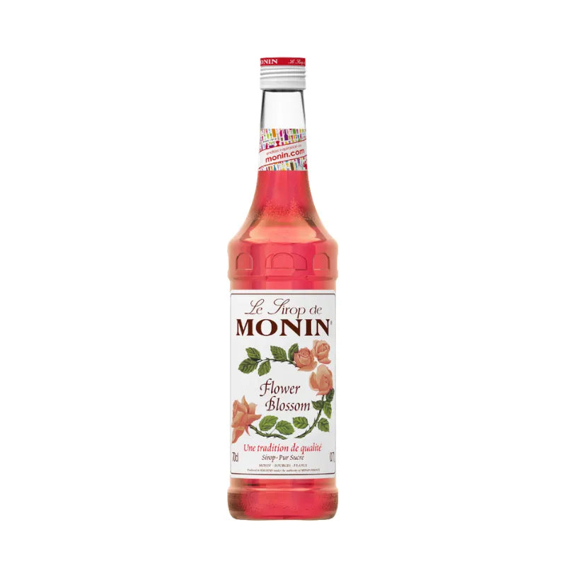 Bottle of MONIN Flower Blossom Syrup 700ml for dry grocery, featuring pastel floral label and clear plastic bottle.