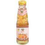 Bottle of Pantainorasingh Sweet & Sour Plum Sauce with label visible, used for Asian cuisine and dipping.