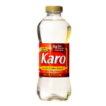 Karo Light Corn Syrup bottle with clear label and golden syrup inside, used for baking and cooking in grocery kitchen.