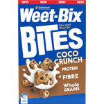Sanitarium Weet-Bix Bites Coco Crunch breakfast cereal in a bowl with coconut flakes and milk on a white background