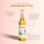 Bottle of MONIN Brown Butter flavored syrup in 700ml size, suitable for coffee, desserts, and culinary uses
