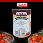 Canned Brook tomatoes in tomato juice, 20-ounce can, showing ripe tomatoes inside the transparent can.