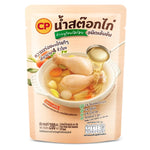 Clear chicken broth from Smart Soup, showcasing a bowl of transparent, flavorful soup in a white bowl on a wooden table.