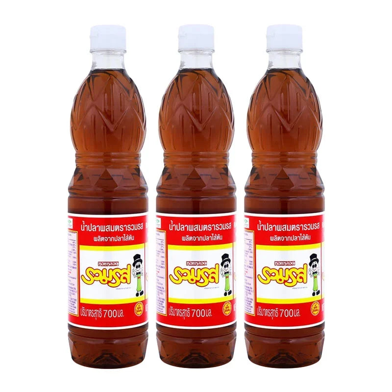 Ruamros Mix Fish Sauce bottles, 700ml each, in a set of three, shown in clear glass bottles with labels, on a grocery shelf.