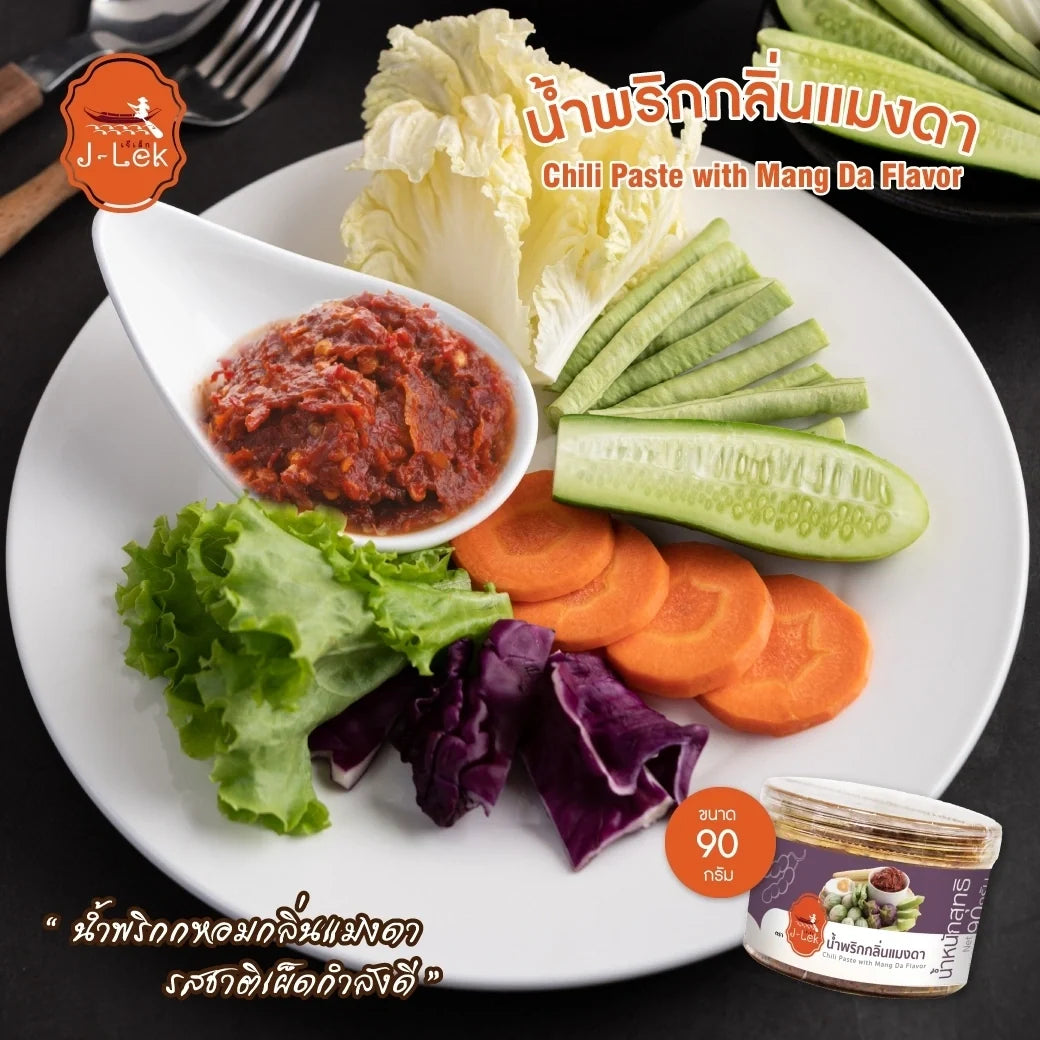 J-lek Maeng Da Chili Paste 90g in a jar, spicy dry grocery product with red chili peppers and vibrant packaging.