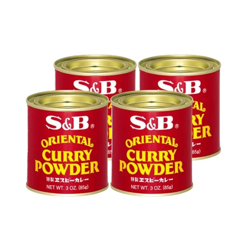 Four cans of S & B Oriental Curry Powder in 85g packaging, shown stacked with labels visible on each can.