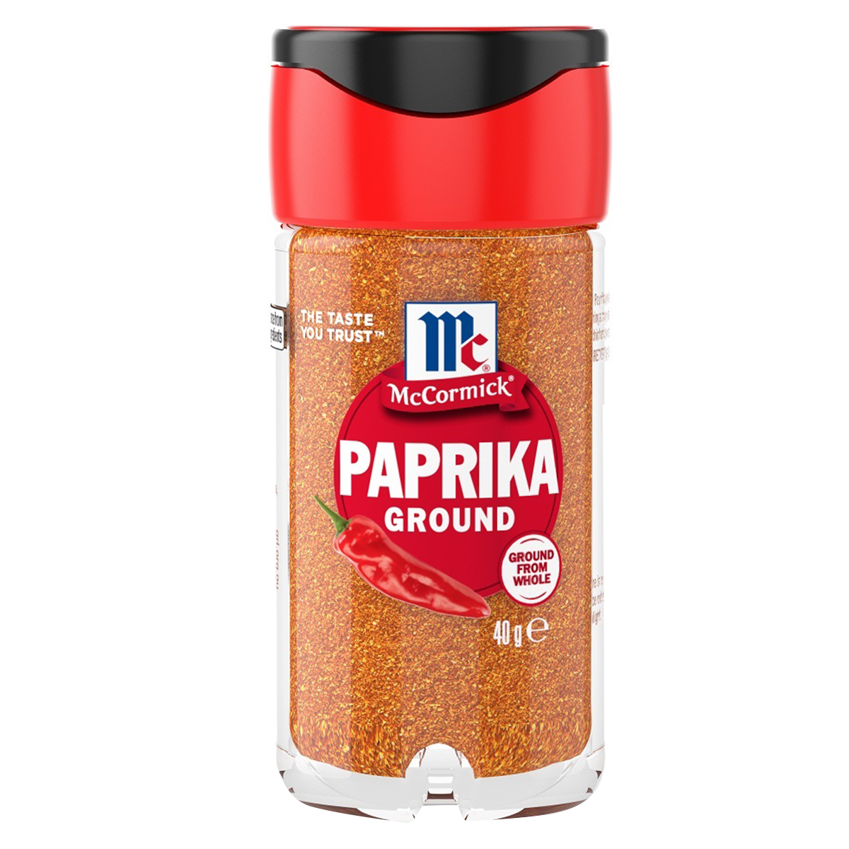 Ground McCormick paprika spice in a jar, showing vibrant red-orange powder for culinary use.