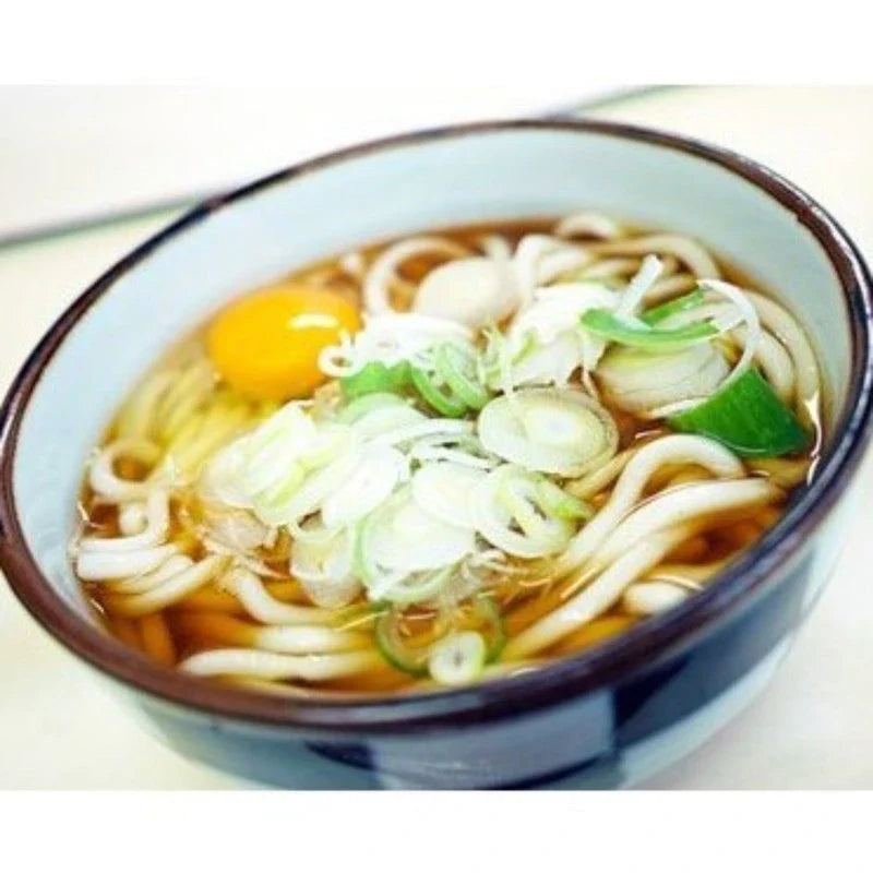 Dry Nisshin No.1 Udon noodles in 200g package, showcasing the uncooked, flat wheat noodles from the Japanese brand NISSHIN.