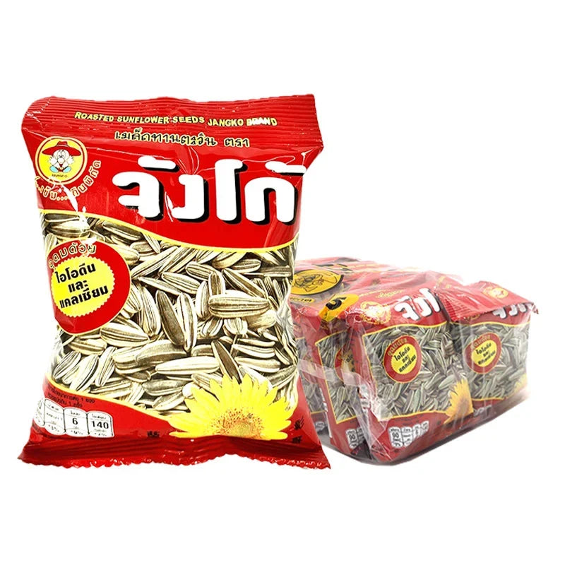 Jangko Roasted Sunflower Seeds with Herbs in 15g packets, a dry snack with herbs, displayed in a clear container.