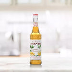 Monin Lemonade Concentrate Syrup 700ml bottle with label, used for making refreshing lemon-flavored beverages.