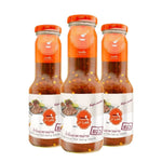 Three 360g glass bottles of J-LEK Jae Lek grilled food sauce, featuring clear labels and metal caps, in a close-up view