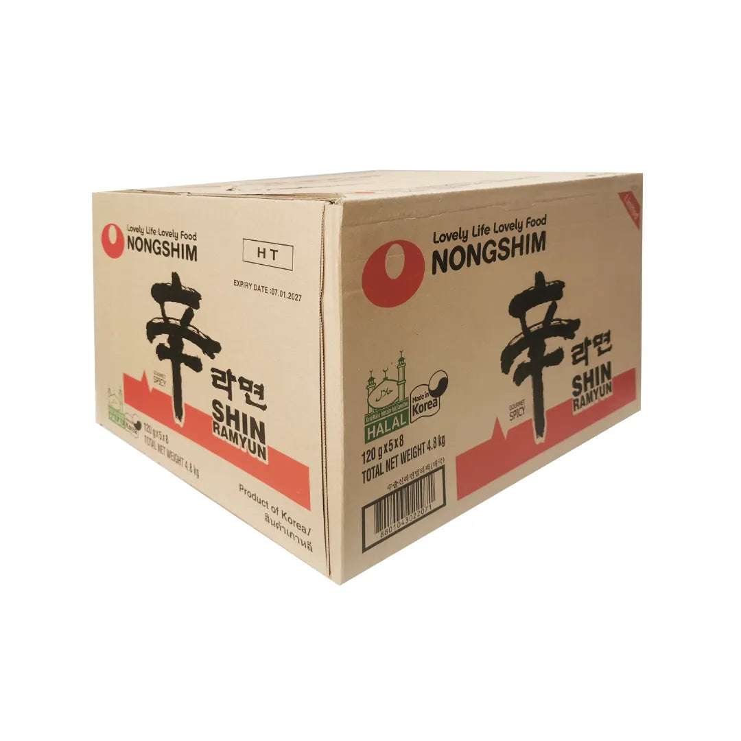 Nongshim Shin Ramyun dry grocery instant ramen noodles in a cup with broth, featuring spicy seasoning and fresh ingredients.