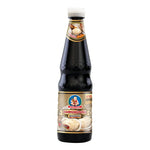 Deksomboon Thick Oyster Sauce 670g jar, showcasing the rich, dark sauce with a smooth, glossy texture in a clear glass container.