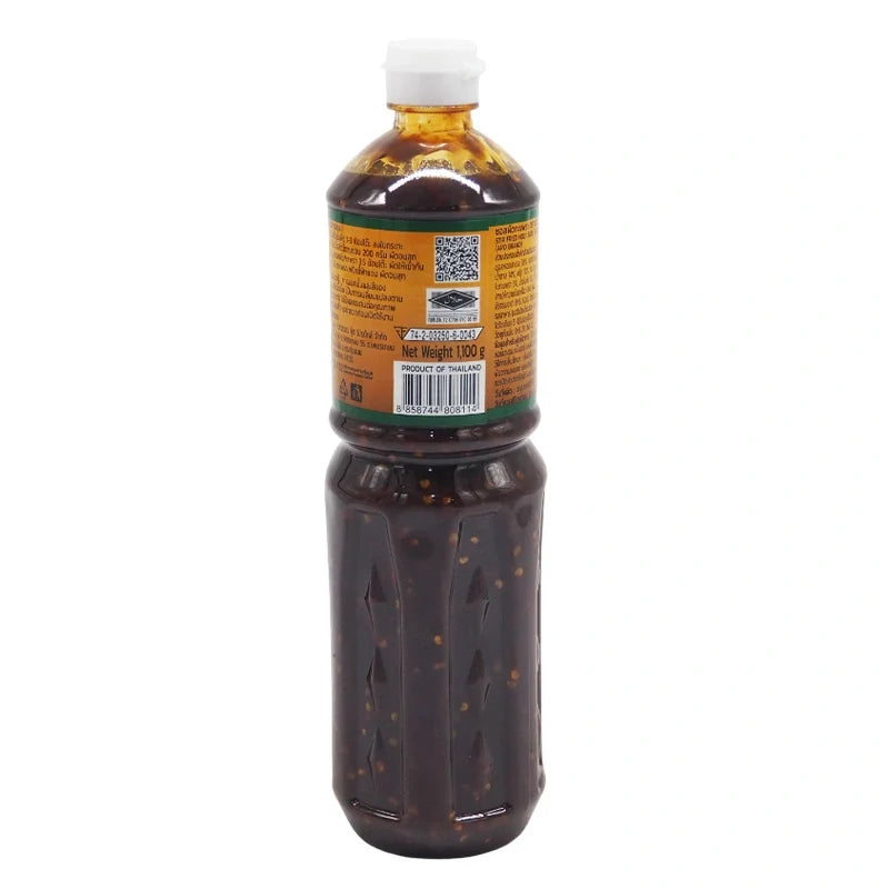 ARO Stir Fried Holy Basil Sauce in 1.1kg bottle, Thai-style dry grocery sauce with fresh basil and savory ingredients.