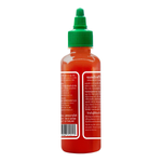 Bottle of Sriracha Hot Spicy Chilli Sauce from Sriracha brand, showing the red sauce in a clear squeeze bottle.