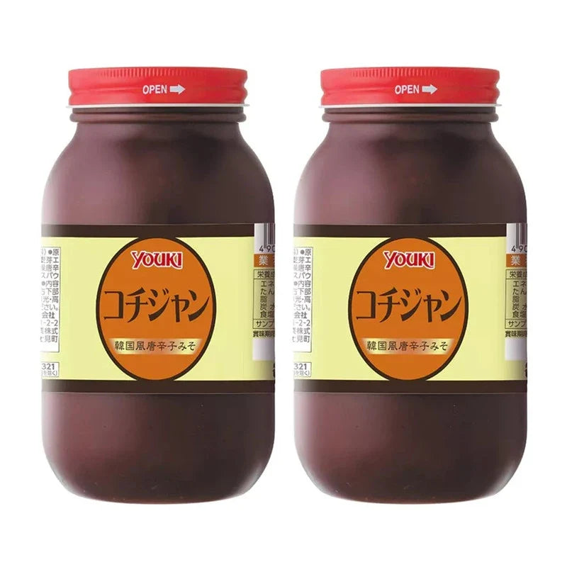 Youki Gochujang sweet and spicy miso sauce in a jar, Korean style dry grocery product with a red and white label.