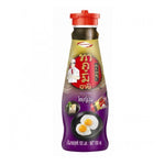 Takumi Soyu Japanese soy sauce bottle in a grocery setting, showcasing the Takumi brand and typical packaging.