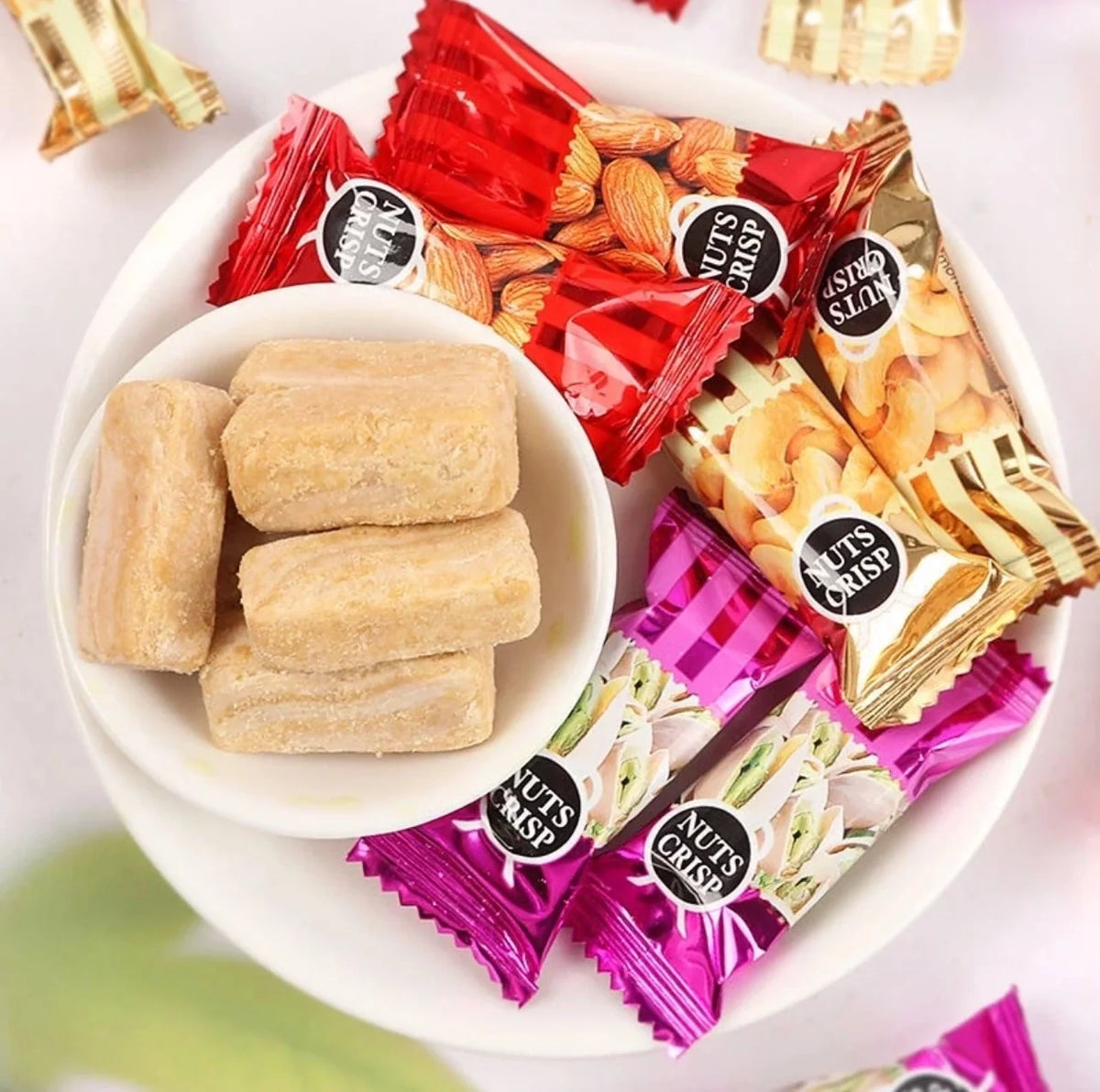 Nezline Nuts Crips snack pack, 500g x2, dry grocery snack with crunchy nut-flavored confectionery in a colorful package.