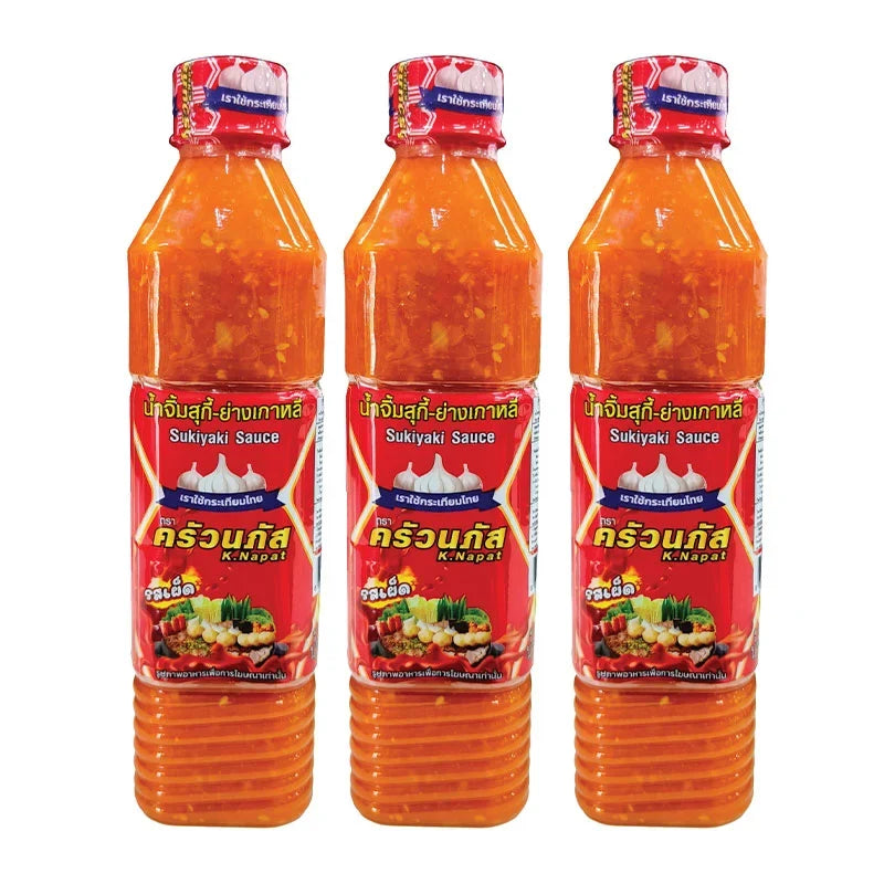 Kruanapat Suki Sauce Spicy, 560g, in three bottles, a Thai dry grocery condiment with a spicy flavor and rich red color.