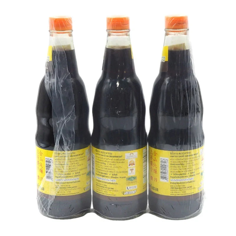 Golden Mountain Soy Sauce bottles, 600ml each, in a pack of three, featuring dark soy sauce from GOLDEN MOUNTAIN brand.