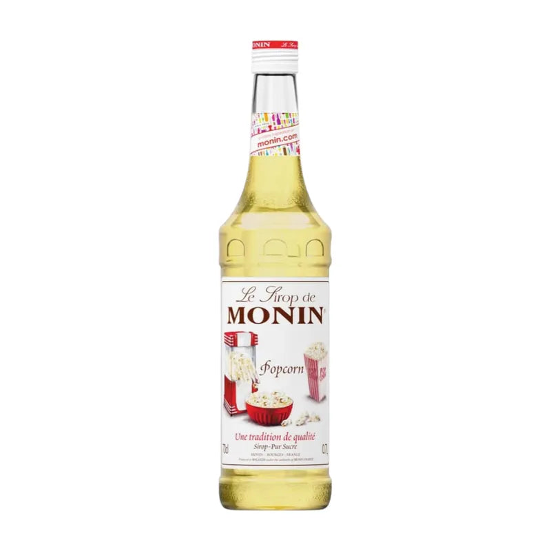 Bottle of MONIN Popcorn Syrup 700ml for dry grocery, featuring a clear label and a dark amber liquid inside.