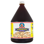DEK SOM Boon Oyster Sauce 2.3kg bottle in a dry grocery store, showcasing the large plastic container with the label visible.