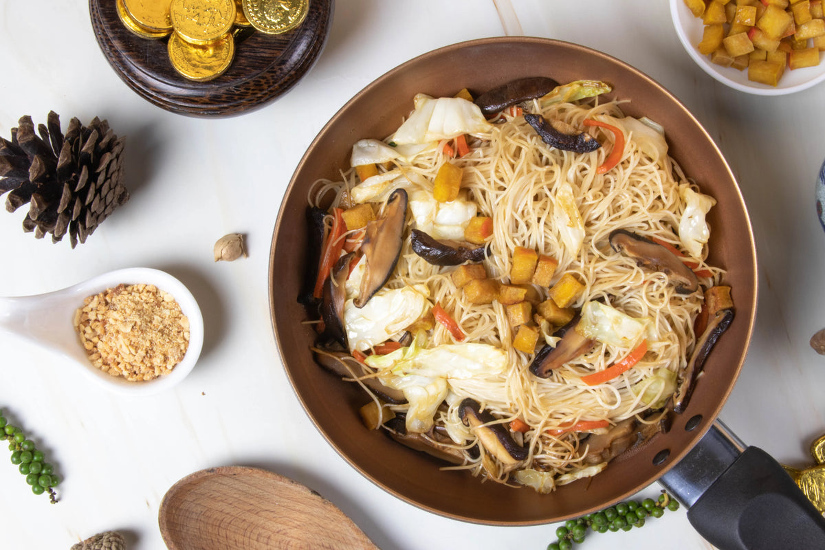 White Chinese noodles from Rabbit Brand, 1kg package, dry grocery product, showing a close-up of the uncooked noodles.