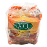 X.O. Butter Caramel Candy 17.6g, close-up of individually wrapped caramel candies in a box, dry grocery snack from X.O. brand.