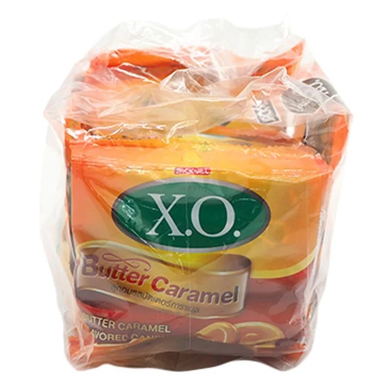 X.O. Butter Caramel Candy 17.6g, close-up of individually wrapped caramel candies in a box, dry grocery snack from X.O. brand.