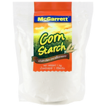 McGarrett Corn Flour package showing bright yellow flour in a clear bag, labeled with the McGarrett brand for grocery use.