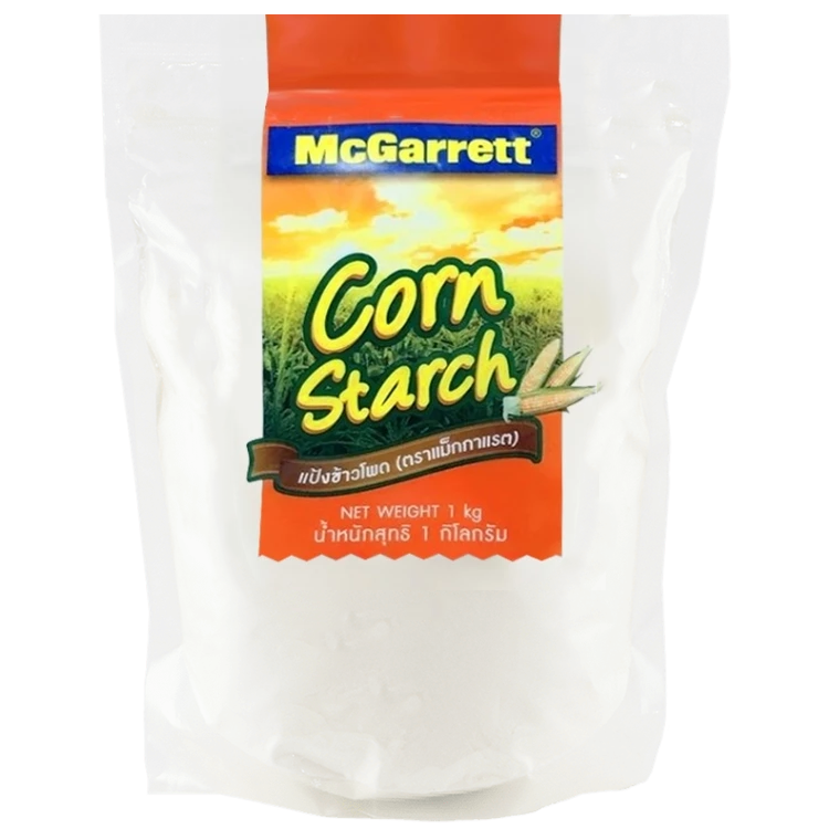McGarrett Corn Flour package showing bright yellow flour in a clear bag, labeled with the McGarrett brand for grocery use.