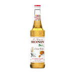 Bottle of MONIN Monin Cr dry grocery product with clear label, shown in a close-up shot.