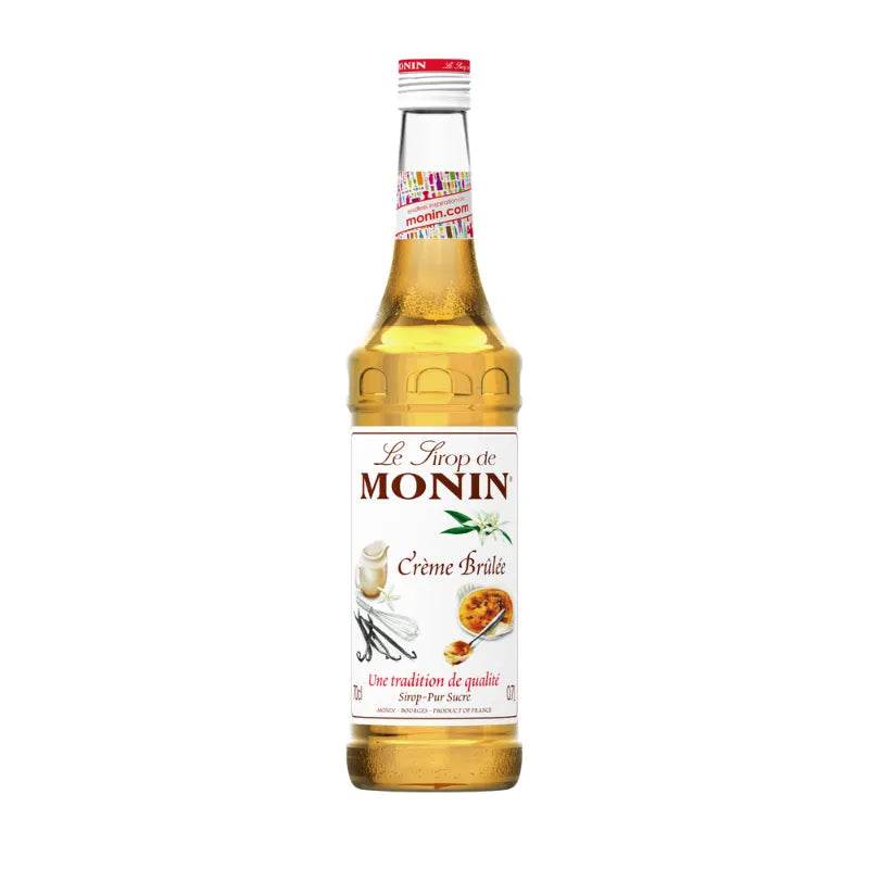 Bottle of MONIN Monin Cr dry grocery product with clear label, shown in a close-up shot.