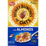 Bowl of Post Honey Bunches of Oats with Almonds cereal in a white bowl on a wooden table, showing crunchy oats and almond pieces.
