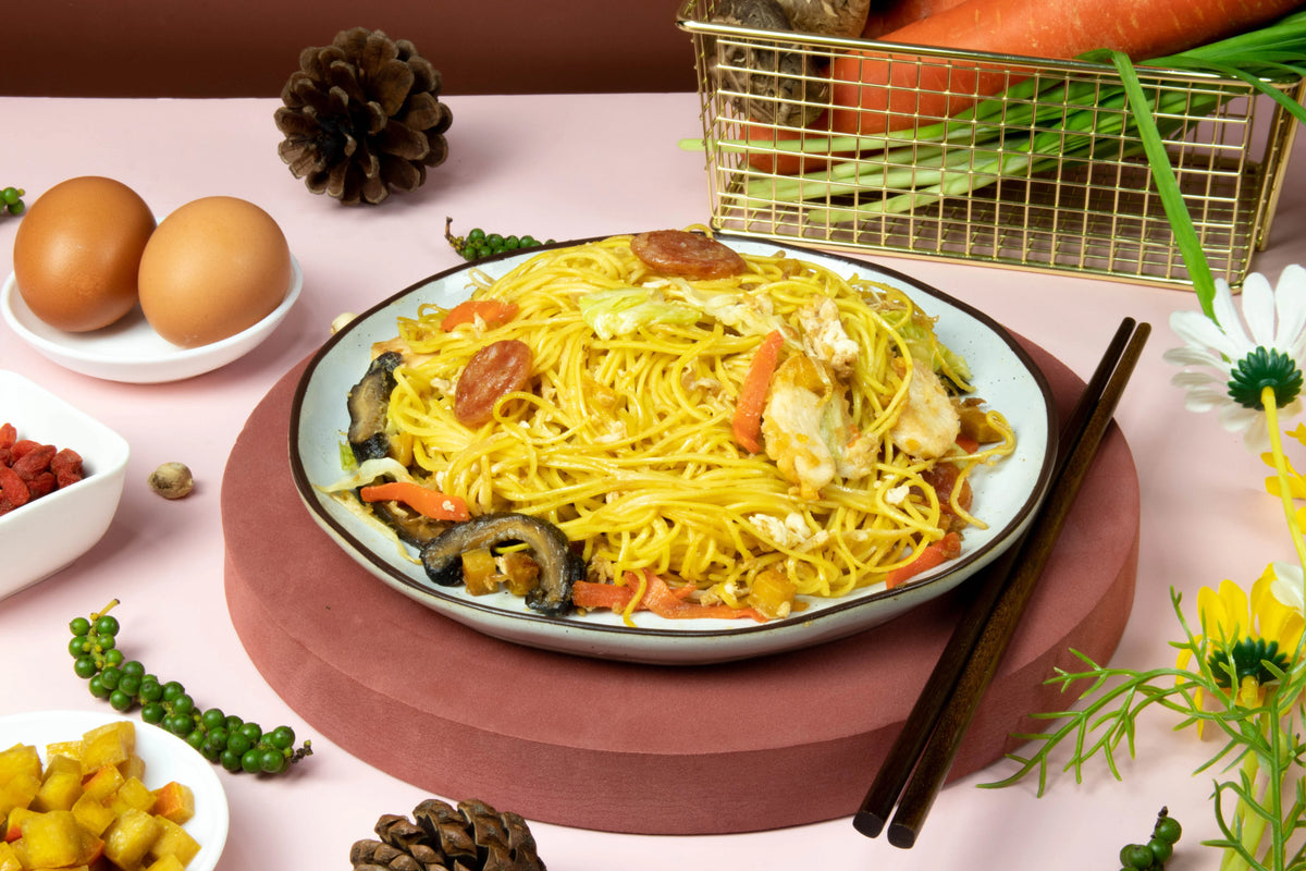 Rabbit Brand Yellow Chinese Noodles 1kg, dry grocery product, showing a bundle of uncooked yellow Chinese noodles in a clear bag.