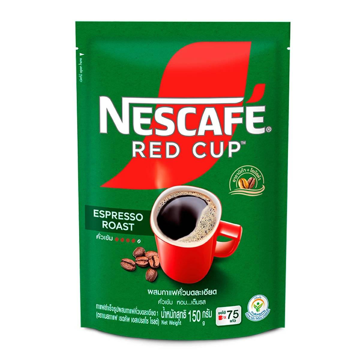 Cup of Nescafe Espresso Roast coffee drink in a glass, showcasing its rich, dark color and smooth texture.
